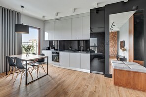 Appartement Deluxe, 1 grand lit et 1 canapé-lit, vue fleuve | Coin cuisine privé
