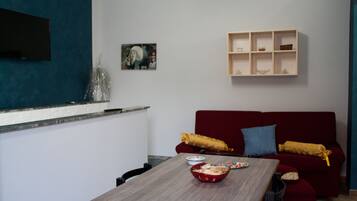 Family Studio | Living area | Flat-screen TV