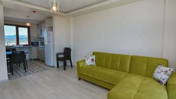 Family Suite, 1 Queen Bed with Sofa bed, Kitchen, Sea View | Living area | LCD TV