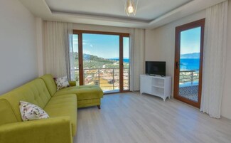 Family Suite, 1 Queen Bed with Sofa bed, Kitchen, Sea View | Living area | LCD TV