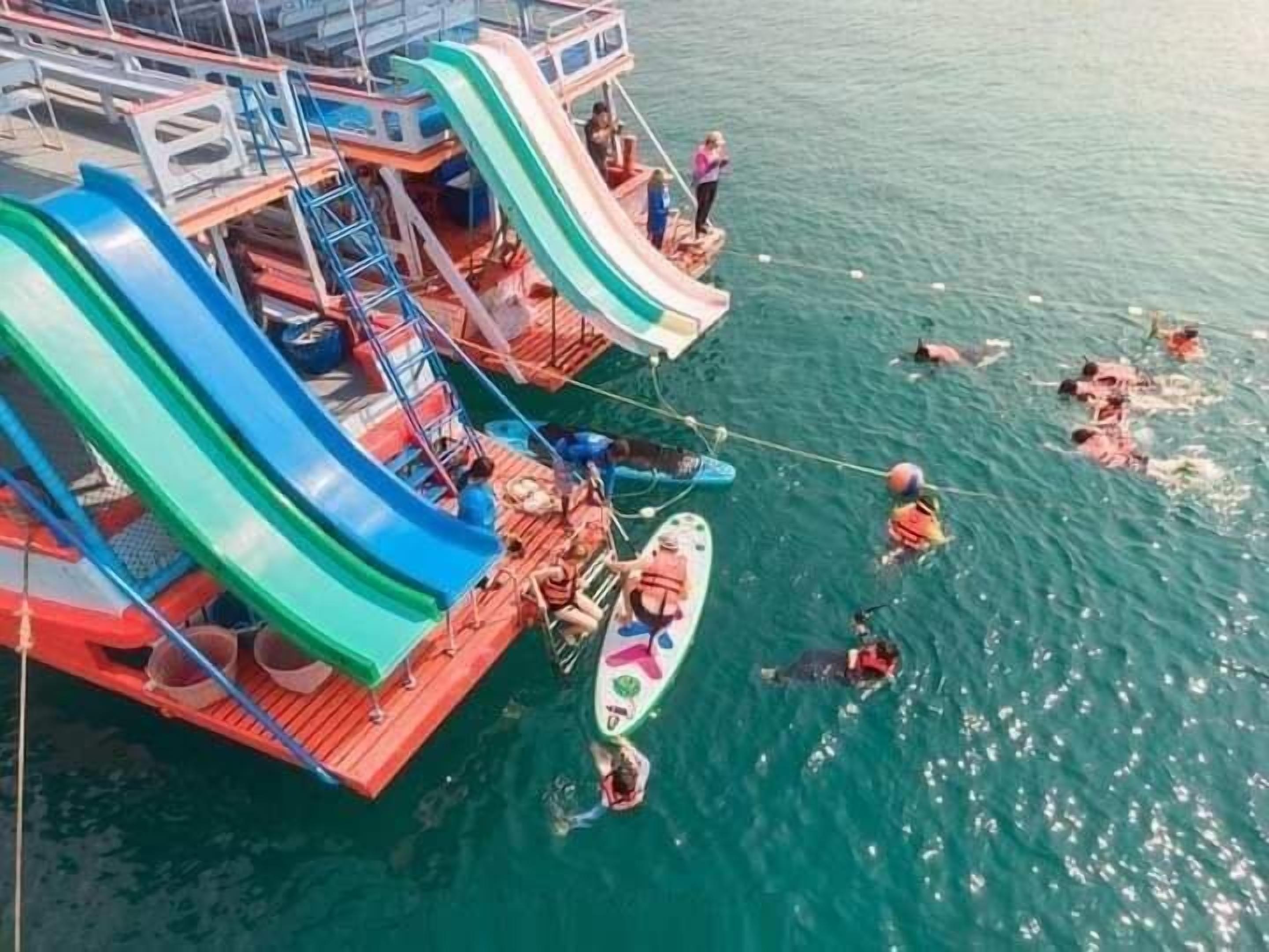 A water park with multiple slides and a swimming area.