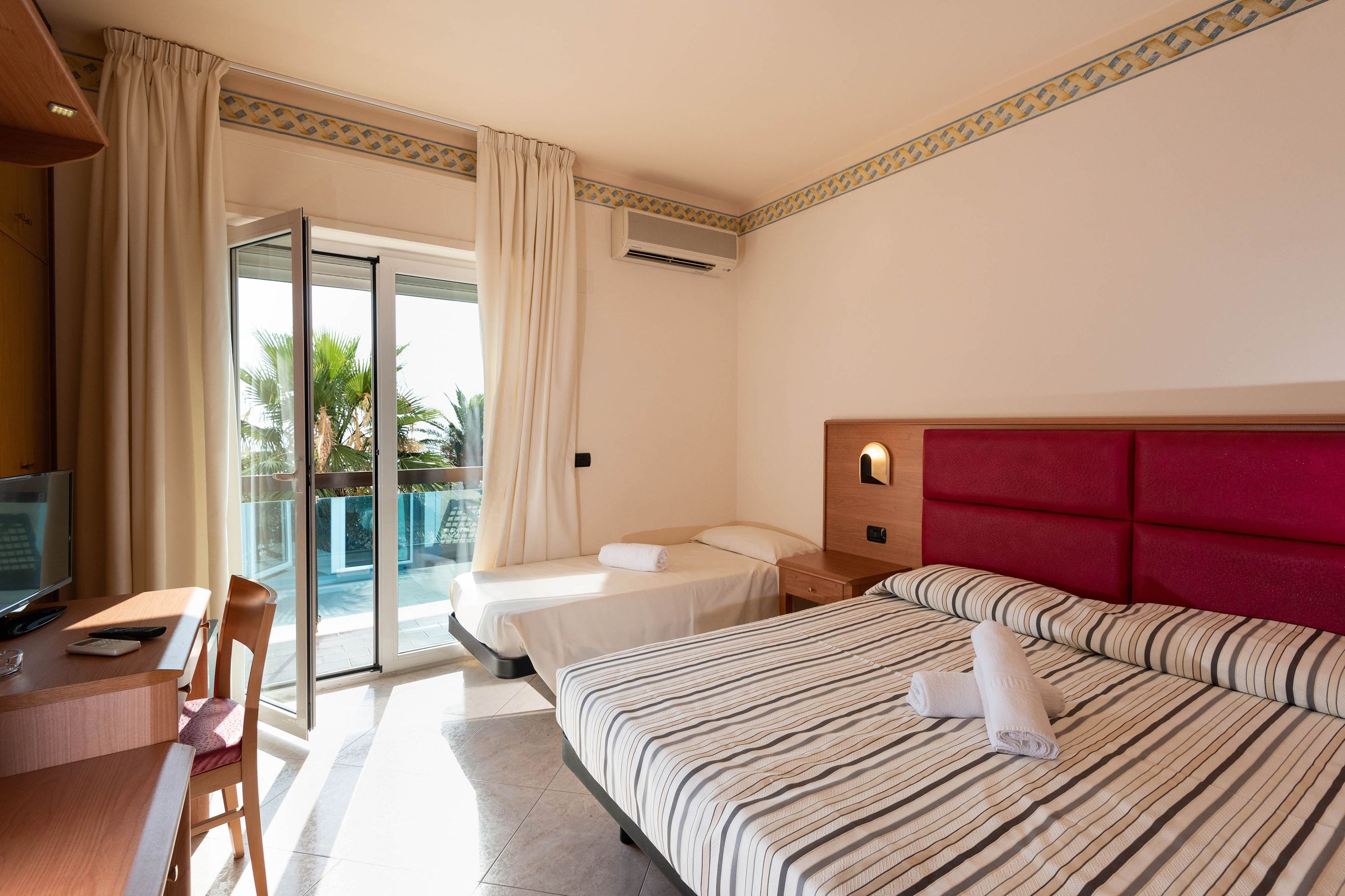 classic triple room, multiple beds, non smoking | in-room safe, desk, blackout curtains, free wifi