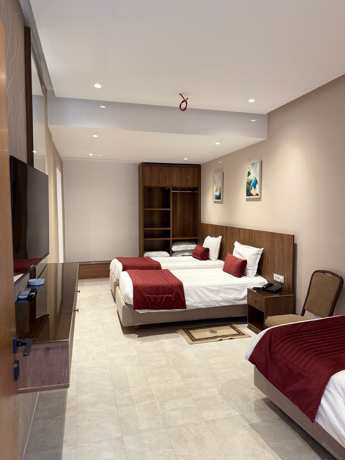 Triple Room | Desk, blackout curtains, iron/ironing board, free cots/infant beds