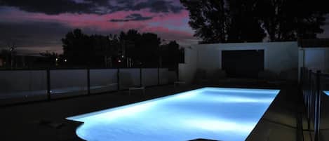 Seasonal outdoor pool, pool loungers