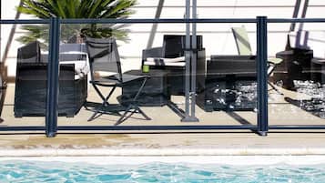 Seasonal outdoor pool, pool loungers