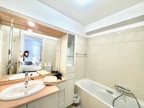 Bathtub, hair dryer, towels