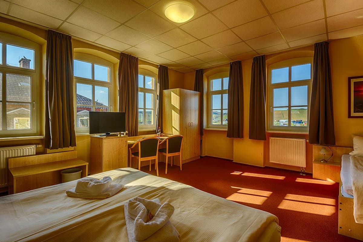 desk, laptop workspace, blackout curtains, iron/ironing board