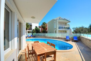 Outdoor pool, pool umbrellas, pool loungers