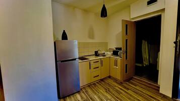 Family Room | Private kitchen | Oven, stovetop, coffee/tea maker, electric kettle