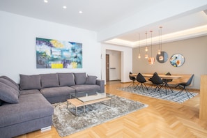 Apartment, 3 Bedrooms | Living room | Flat-screen TV