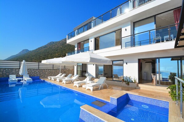 Outdoor pool, pool umbrellas, pool loungers