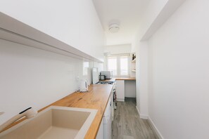 Appartement | Coin cuisine privé | Réfrigérateur, micro-ondes, four, lave-vaisselle