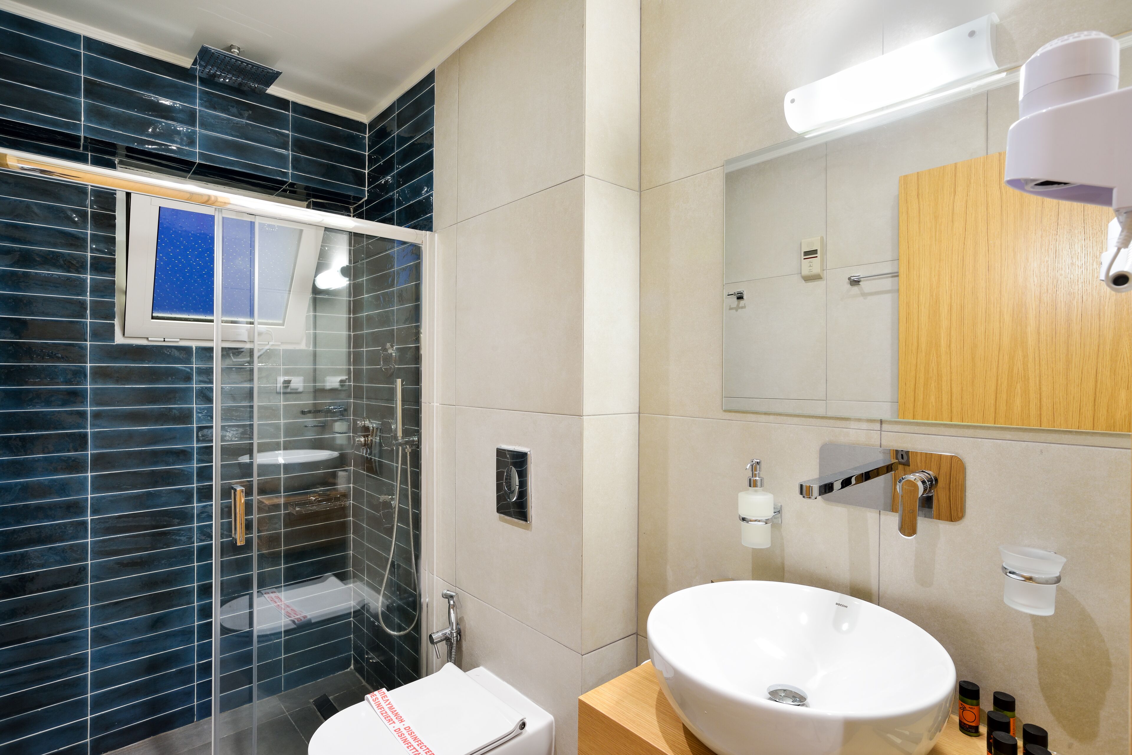 deluxe room with balcony | bathroom | shower, free toiletries, hair dryer, bathrobes