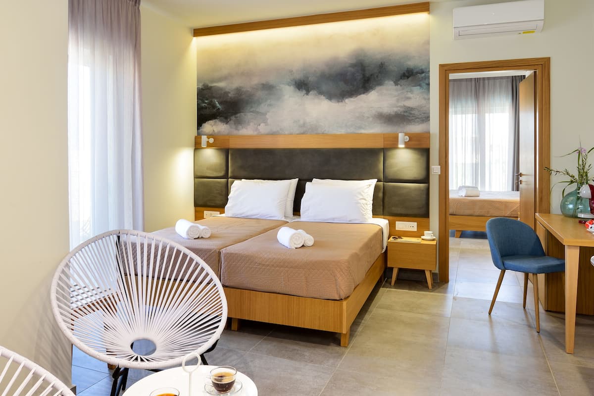 two bedroom suite with balcony | living room | flat-screen tv