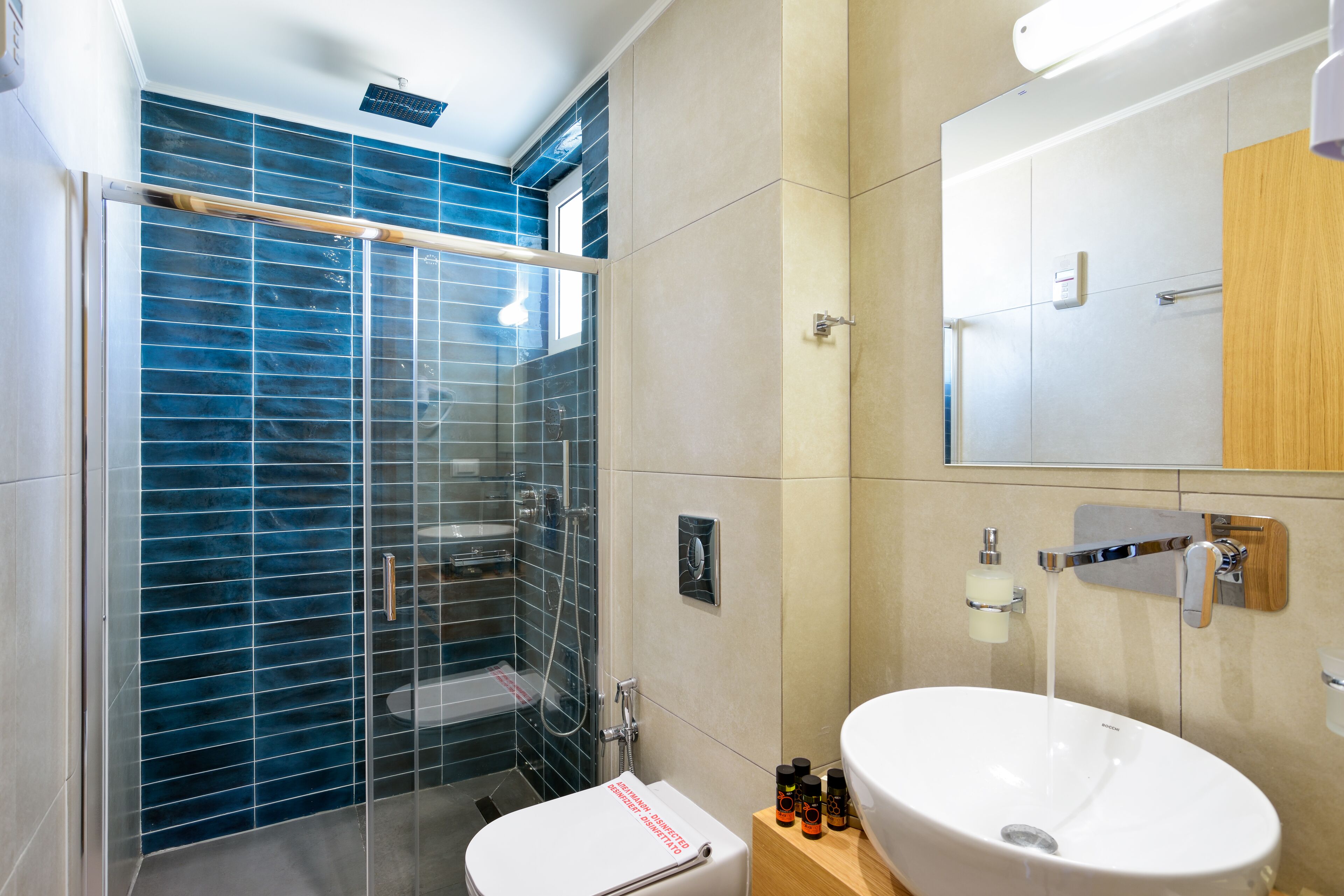 deluxe room with balcony | bathroom | shower, free toiletries, hair dryer, bathrobes