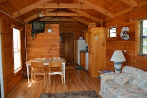 Cabin, 2 Bedrooms (Cabin 60) | Living area | TV - Camp Mack Lodge, Marina & RV Resort (Lake Wales)