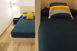 Deluxe Quadruple Room, Private Bathroom | Premium bedding, in-room safe, soundproofing, free WiFi - TAKE Hostel Conil (Conil de la Frontera)