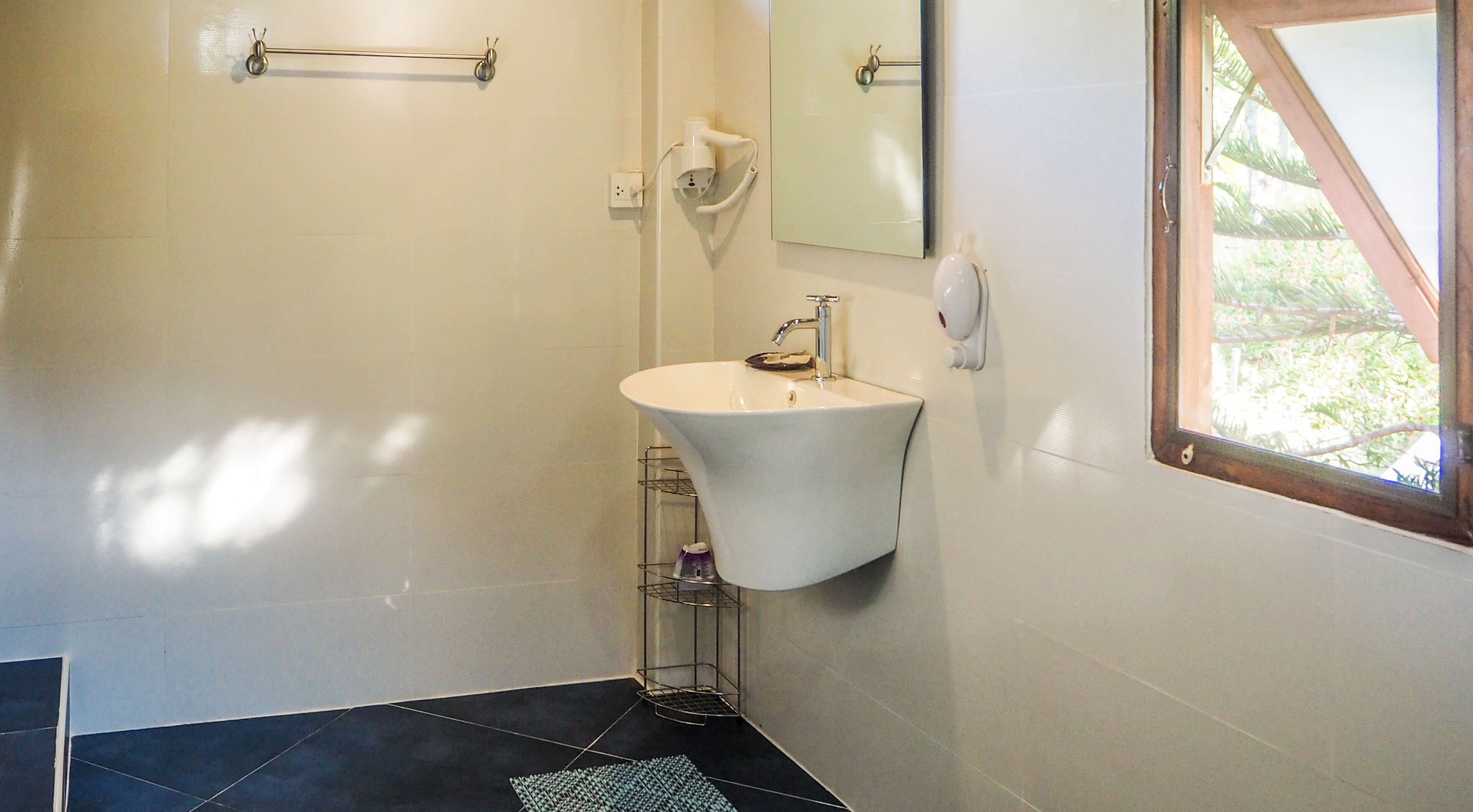 deluxe room, 1 king bed | bathroom | shower, rainfall showerhead, free toiletries, hair dryer