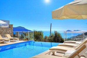 Outdoor pool, pool umbrellas, pool loungers