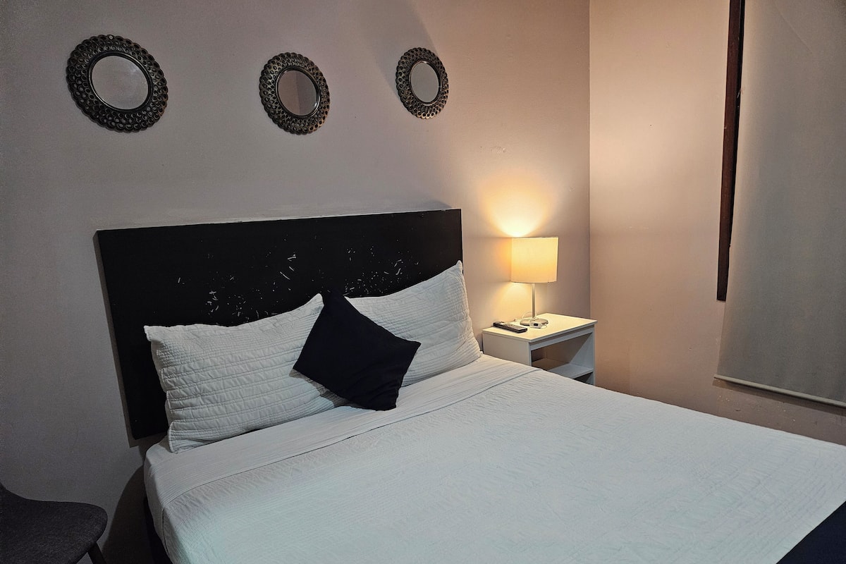 Premium bedding, blackout drapes, iron/ironing board, free WiFi