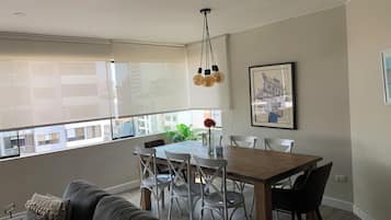 Business Apartment, 4 Bedrooms | Living area | Flat-screen TV