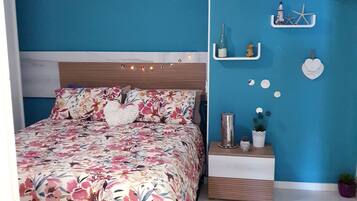 1 bedroom, desk, iron/ironing board, travel crib