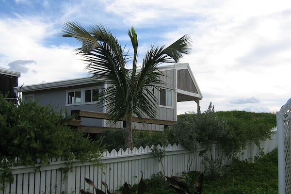 Cottage viewed from road.
