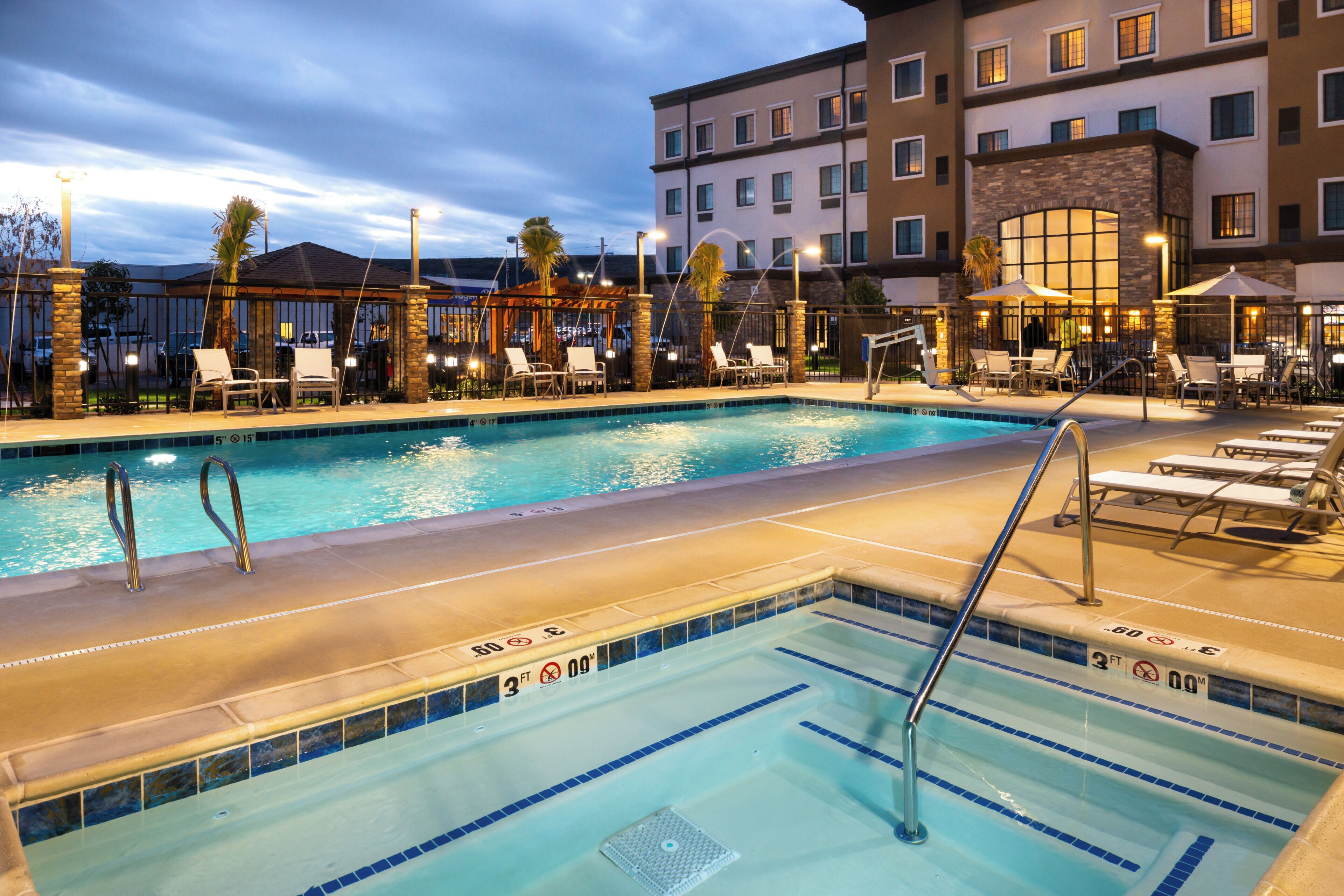 Outdoor pool, open 8:00 AM to 10:00 PM, pool umbrellas, pool loungers