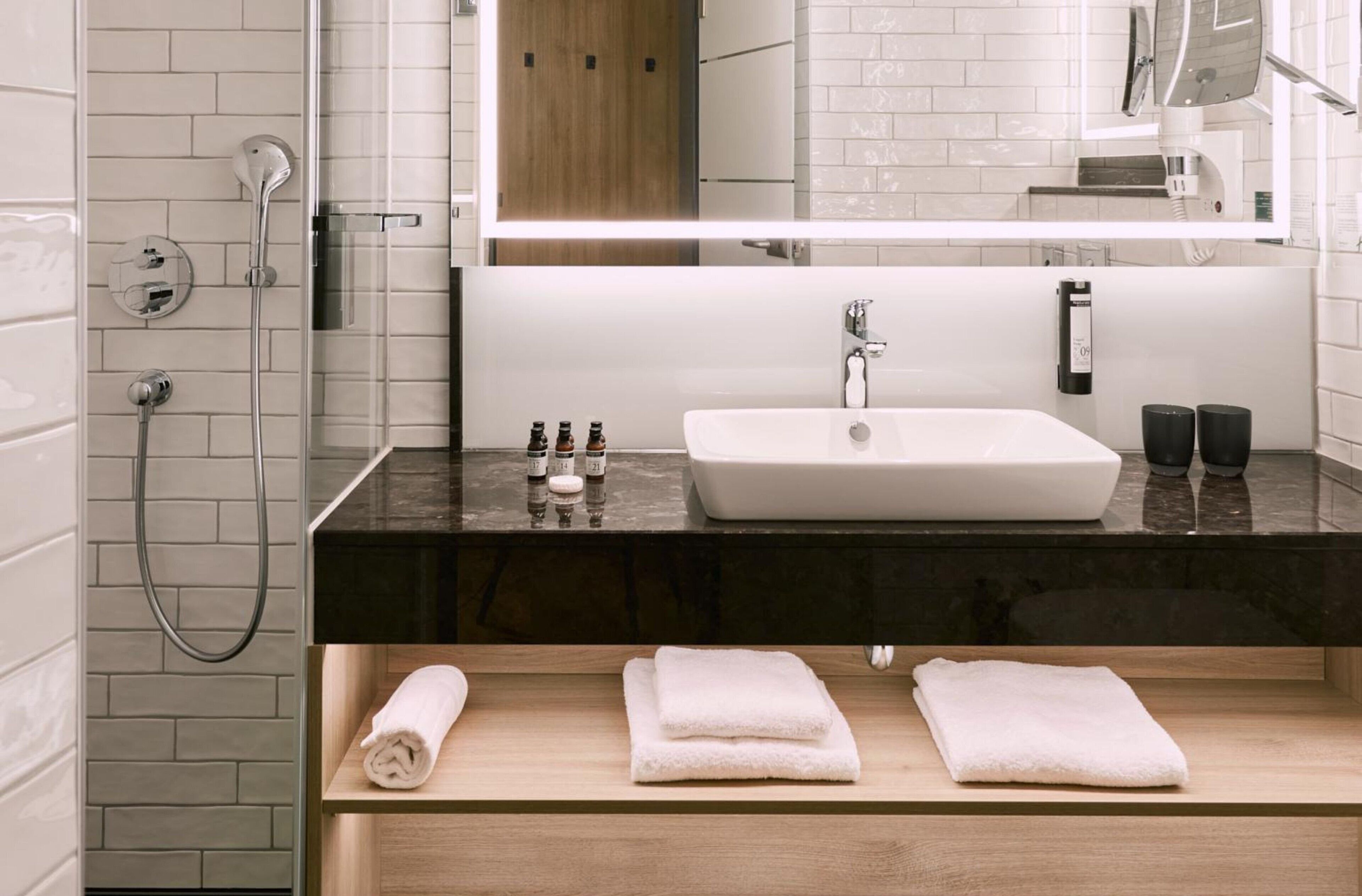 shower, hair dryer, bathrobes, slippers