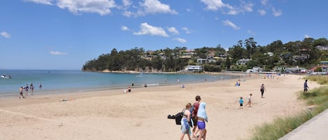 On the beach, sun-loungers