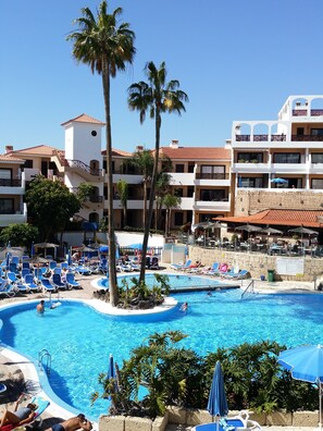 A heated pool, sun loungers
