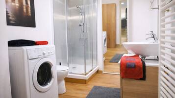 Shower, hair dryer, towels, toilet paper