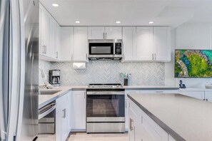Coffee/tea maker, fridge, microwave, oven