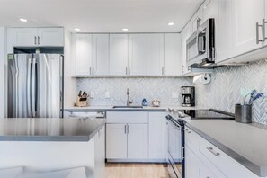 Fridge, microwave, oven, stovetop - Modern Ground Floor Retreat  - Kihei Surfside #110 - Perfect Oceanfront Grounds! (Kihei, Maui)