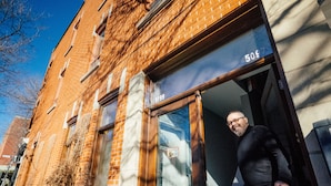 A brick building with a large window and a door. - Montreal Plateau Mont Royal: apartments - 5 rooms - 4/6 persons (Montréal (Plateau Mont-Royal))