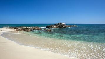 On the beach, sun loungers, beach towels