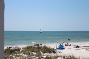 On the beach, sun loungers, beach towels