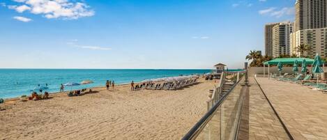 On the beach, sun loungers, beach towels