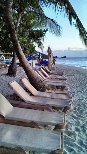 On the beach, sun-loungers, beach towels