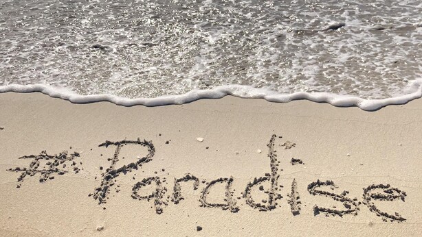 A beach with the word "Paradise" written in the sand. - Luquillo Beach- Puerto Rico, 4 Bedroom Vacation Villa With Pool and Wifi (Luquillo)