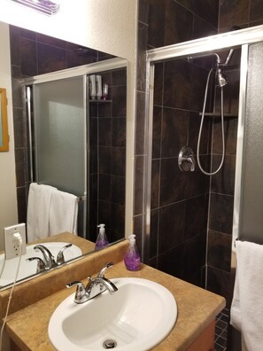 Bathtub, hair dryer, towels, soap