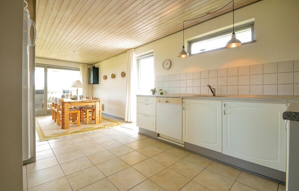 Fridge, stovetop, dishwasher, coffee/tea maker
