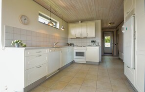 Fridge, stovetop, dishwasher, coffee/tea maker