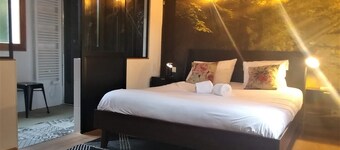 A LITTLE CITY GARDEN AND ITS PRIVATE PARKING AREA