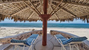 On the beach, sun-loungers, beach towels