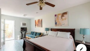 A bedroom with a large bed, a ceiling fan, a television, and a window. - 20 minutes from downtown San Diego.Large clean quiet secured studio.Near 54H 125 (Spring Valley)