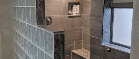 Combined shower/tub, hair dryer, towels, soap
