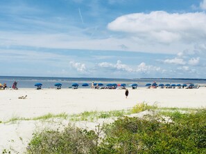 On the beach, sun loungers, beach towels