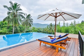 Outdoor pool, open 6:00 AM to 7:00 PM, pool umbrellas, pool loungers