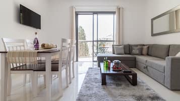 Comfort Apartment, 1 Bedroom | Living area | Flat-screen TV